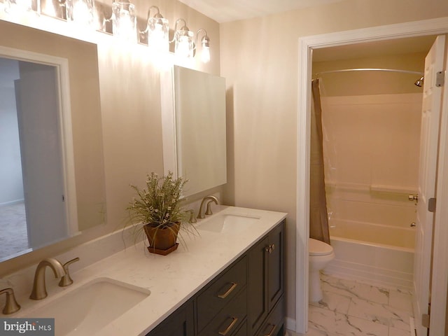 full bathroom with vanity, shower / bath combo, and toilet