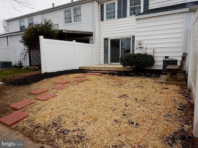 rear view of property featuring cooling unit