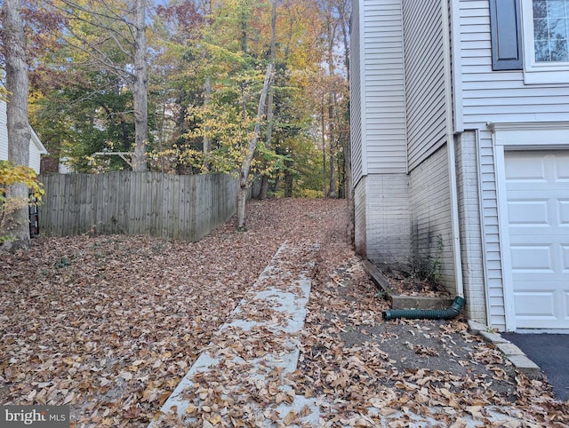 view of yard with a garage