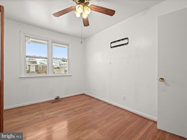 unfurnished room with light wood-type flooring and ceiling fan