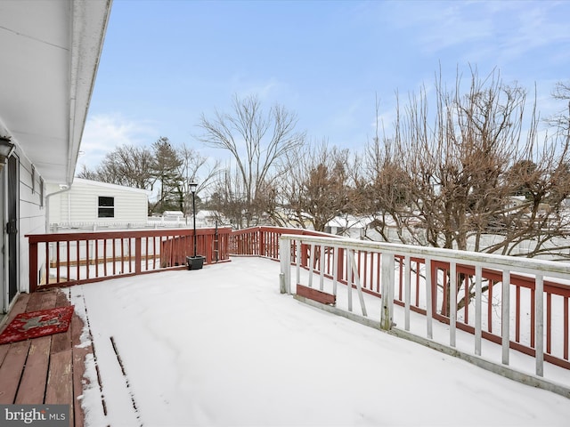 view of snow covered deck