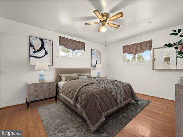 bedroom with hardwood / wood-style flooring and ceiling fan