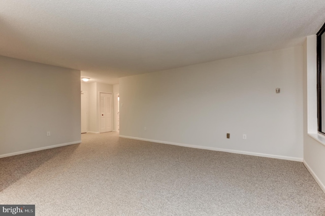 spare room with a textured ceiling