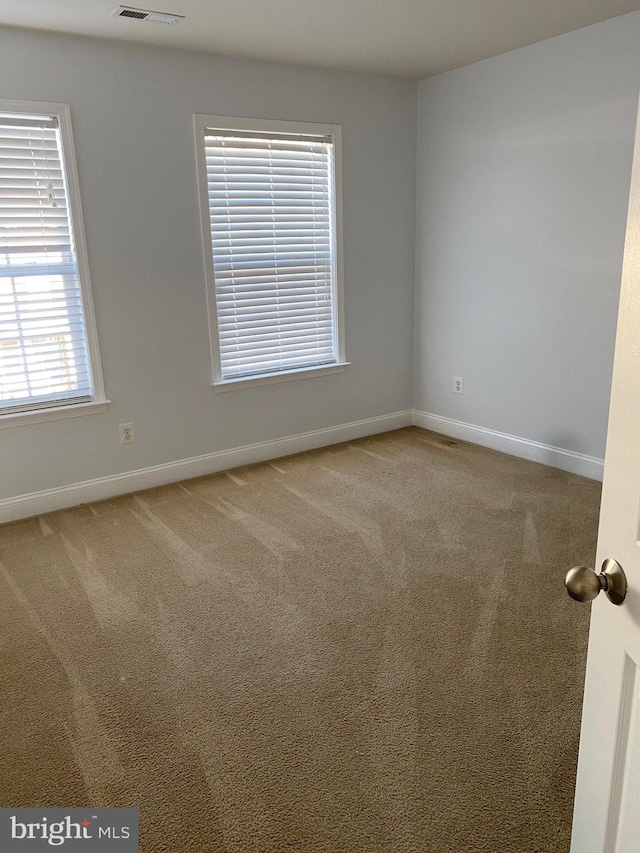 empty room with carpet flooring