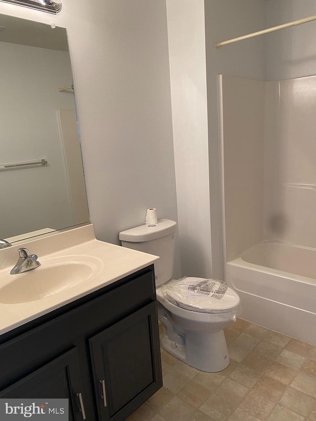 full bathroom with shower / tub combination, vanity, and toilet