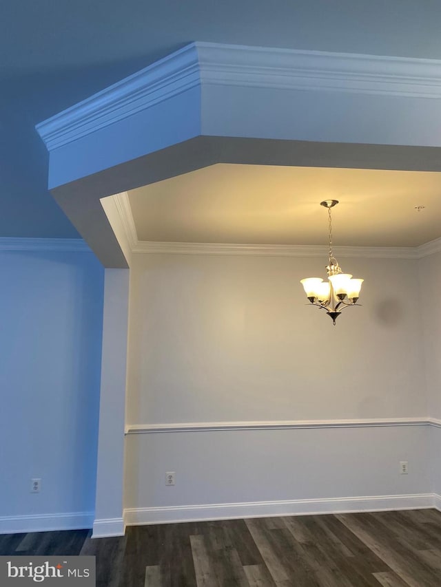 interior space with ornamental molding, dark hardwood / wood-style floors, and a notable chandelier