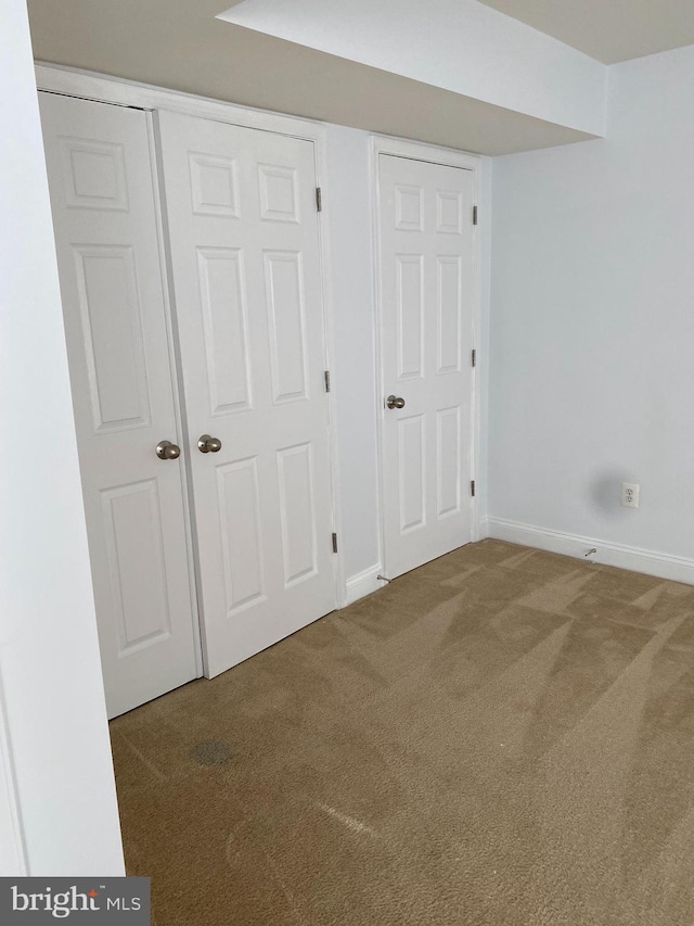 unfurnished bedroom featuring carpet