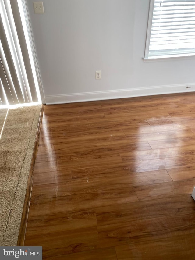 unfurnished room featuring dark hardwood / wood-style floors