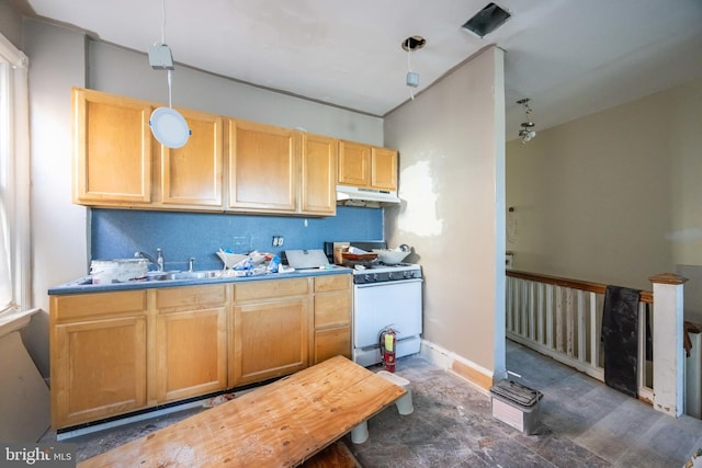 kitchen featuring sink, pendant lighting, and white gas range oven