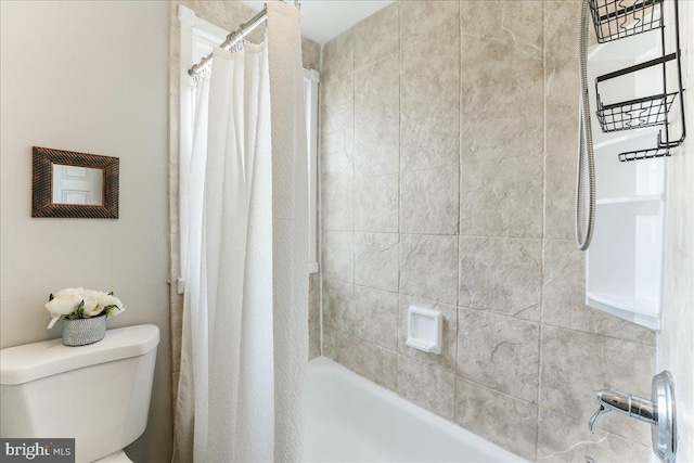 bathroom with shower / tub combo with curtain and toilet