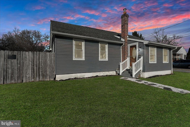 view of front of home featuring a yard