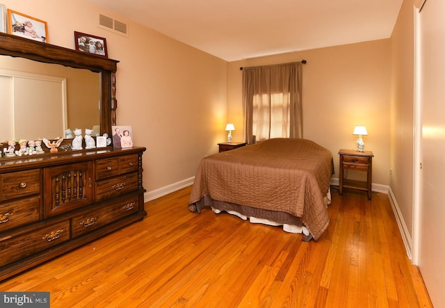 bedroom with light hardwood / wood-style flooring