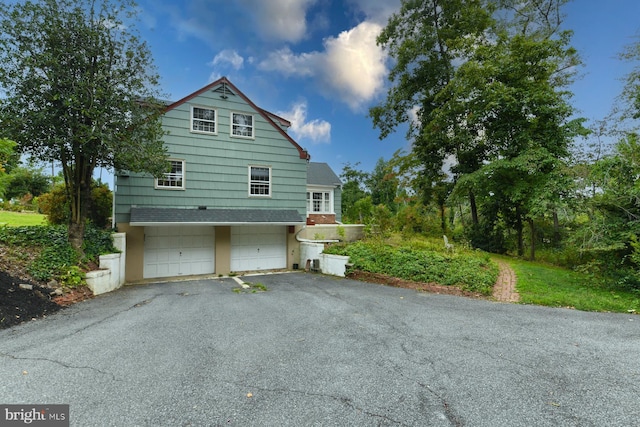 view of home's exterior with a garage