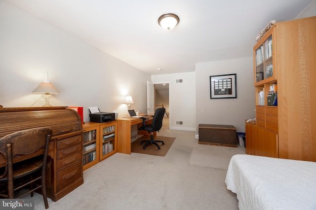 bedroom featuring light colored carpet