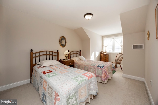 bedroom with light carpet