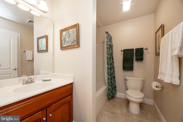 full bathroom with vanity, toilet, and shower / bath combo with shower curtain