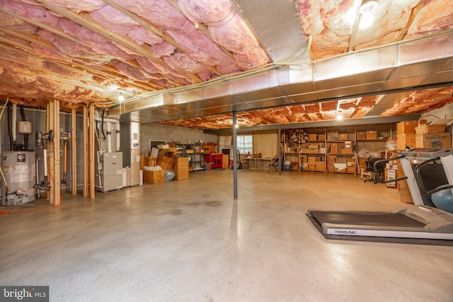 basement featuring heating unit and gas water heater