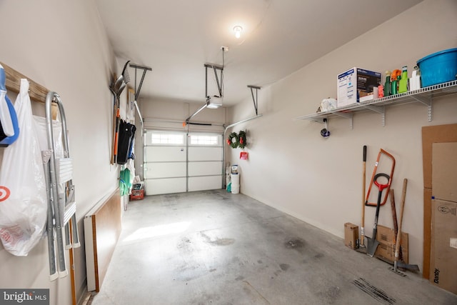 garage with a garage door opener and refrigerator