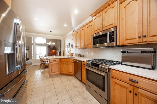 kitchen with pendant lighting, sink, light tile patterned floors, stainless steel appliances, and kitchen peninsula