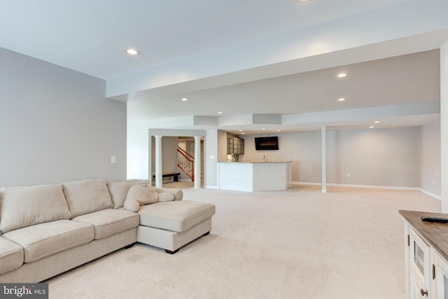 living room with light colored carpet and indoor bar