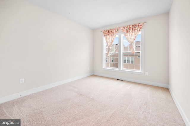 spare room featuring carpet flooring