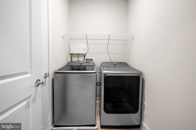 clothes washing area with washer and dryer