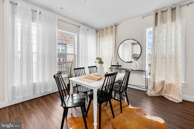 dining room featuring dark hardwood / wood-style flooring