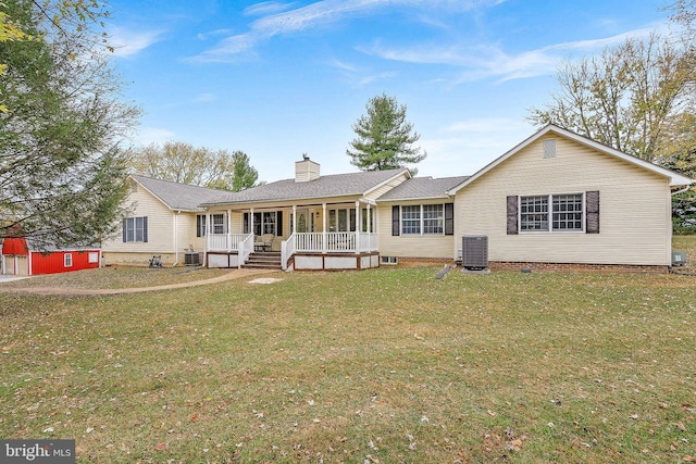 single story home with covered porch, central AC, and a front yard