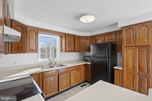 kitchen with sink and black appliances