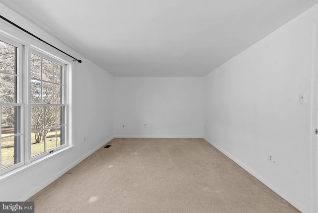 empty room featuring light colored carpet