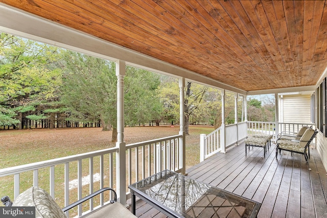 wooden deck featuring a yard