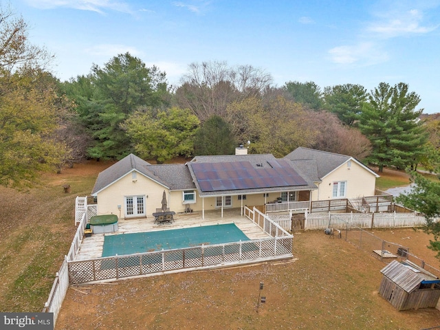 view of pool featuring french doors and a patio area