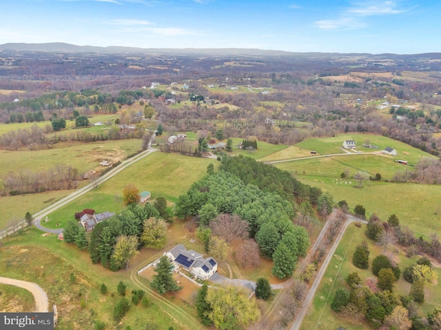 birds eye view of property featuring a rural view