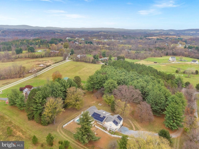 birds eye view of property with a rural view