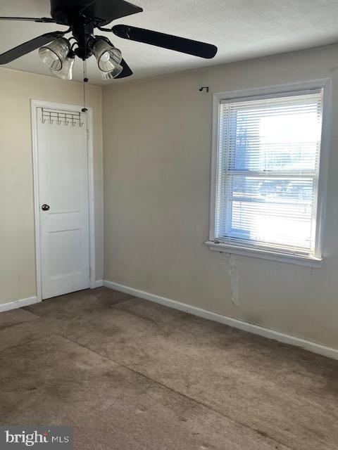 spare room featuring ceiling fan