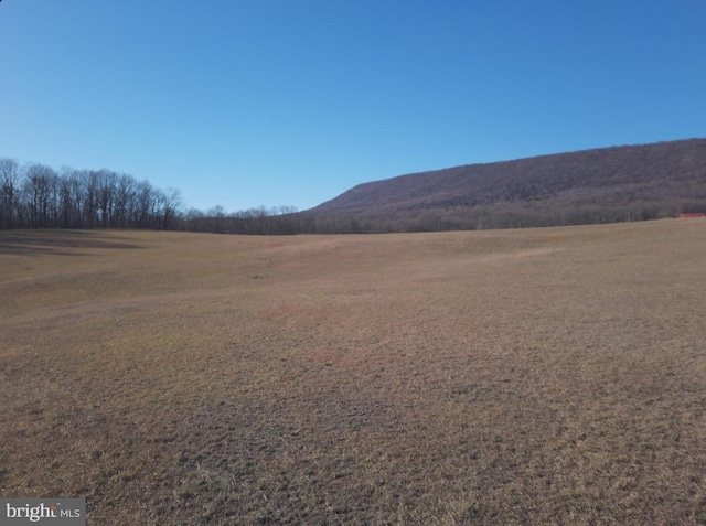 view of mountain feature with a rural view