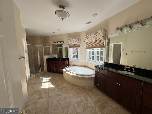 bathroom featuring vanity and plus walk in shower