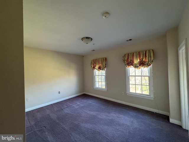 view of carpeted spare room