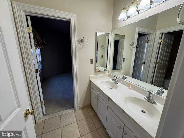 bathroom featuring tile patterned flooring and vanity