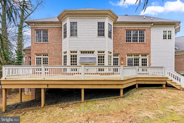 rear view of house featuring a deck