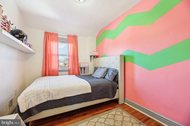 bedroom with wood-type flooring