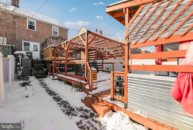 view of snow covered deck