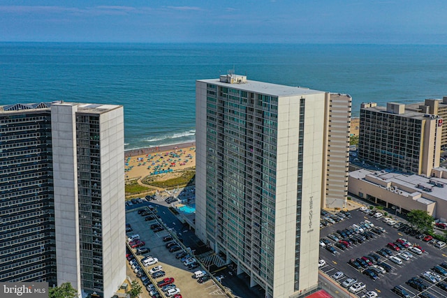 drone / aerial view with a water view and a view of the beach