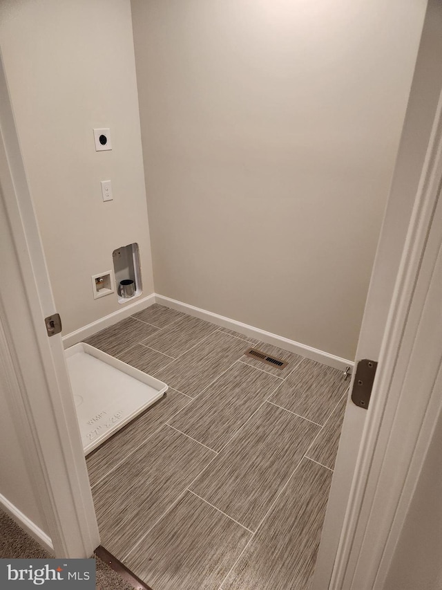 laundry area featuring hookup for an electric dryer and hookup for a washing machine