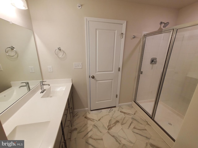 bathroom featuring vanity and a shower with shower door