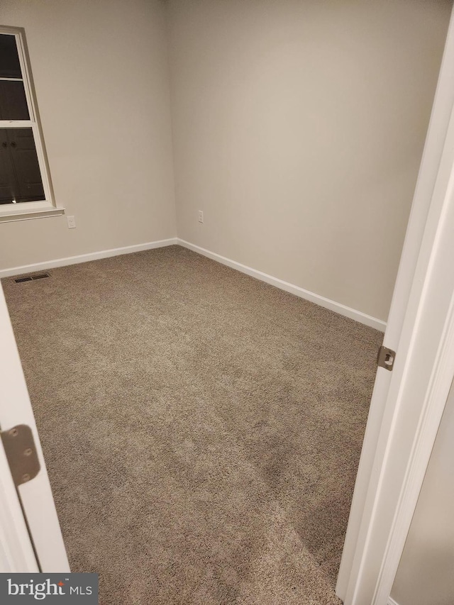 empty room with carpet flooring