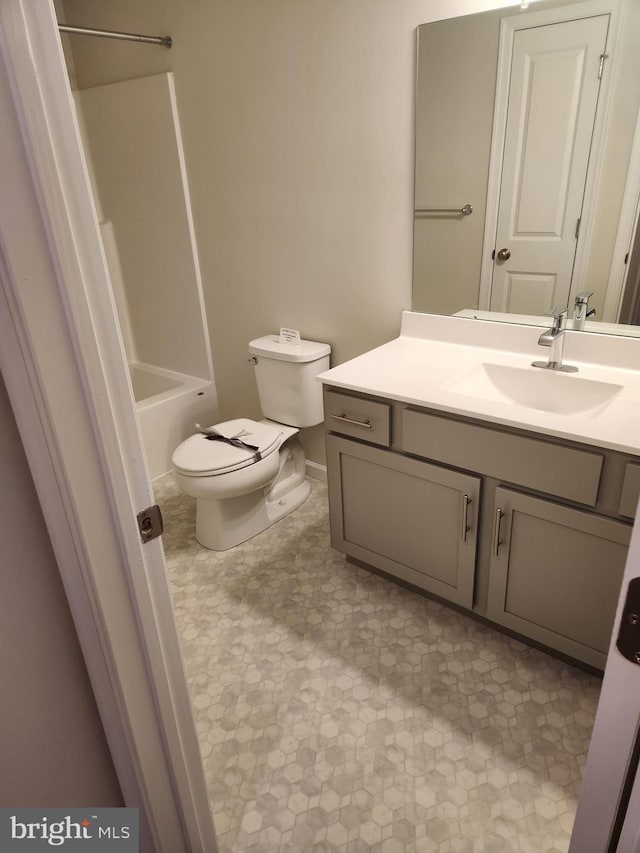 full bathroom with vanity, toilet, and washtub / shower combination