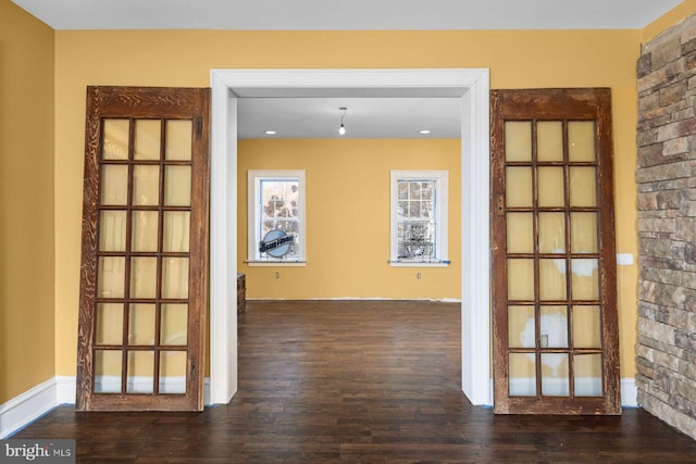 spare room featuring wood-type flooring