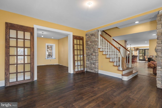 interior space with dark hardwood / wood-style floors and a chandelier