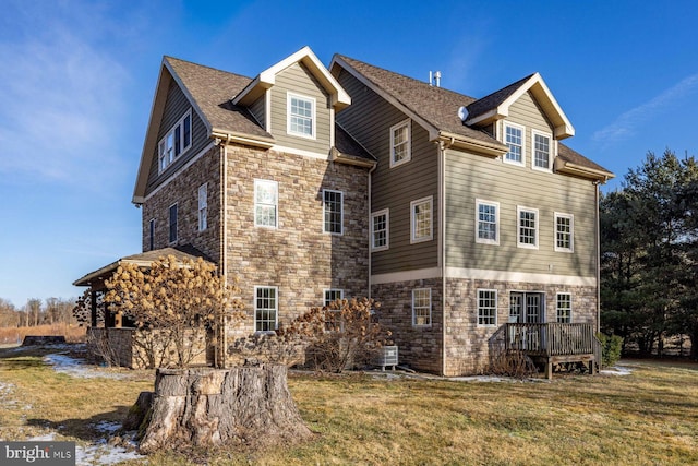 view of home's exterior featuring a yard and a deck